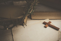 cross, crown of thorns, and white paper