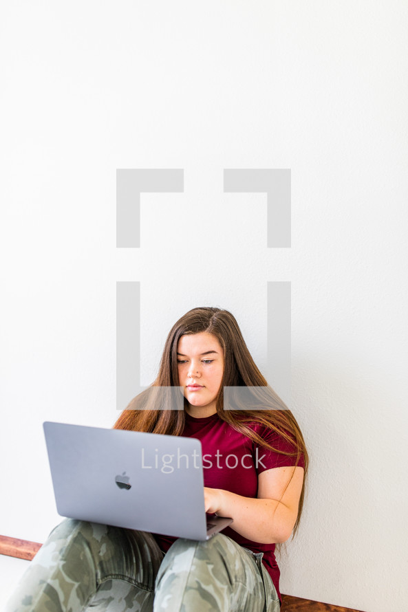 teenager using a laptop computer 