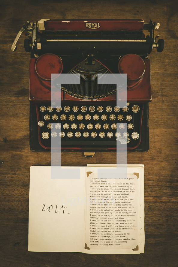 An old manual typewriter and a list of New Year's resolutions for 2014.
