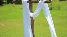 white shroud on a cross