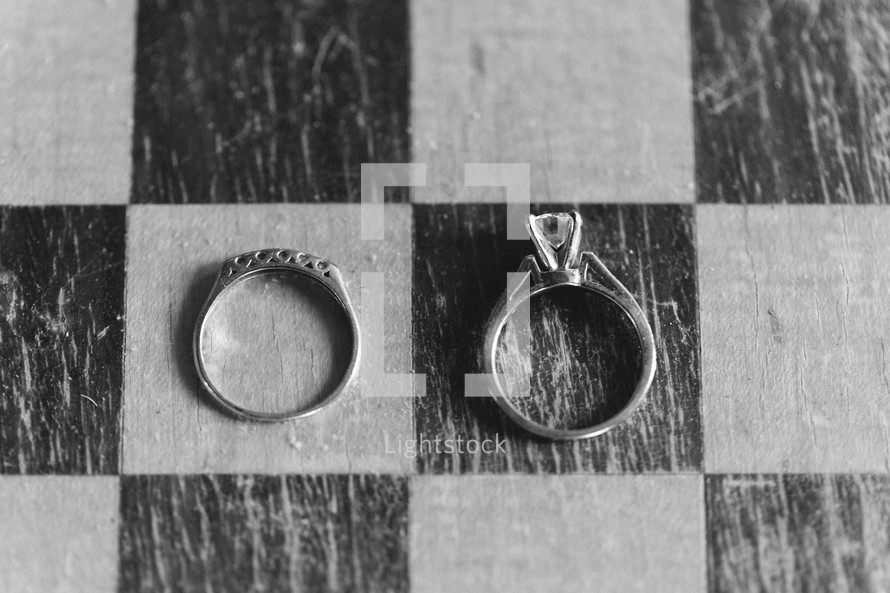 wedding rings on a checker board 