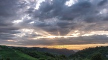 Dramatic sunset sky with sunbeam light in New Zealand wild nature landscape Time lapse
