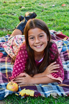 young girl on a fall blanket 