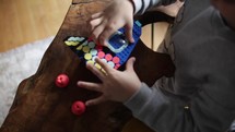 Boy playing Lego blocks indoors