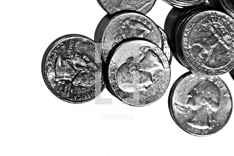 Quarters spread out on a white background