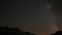 Timelapse of Milky Way with some shooting stars in front of some mountains