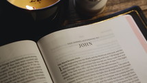Rack Focus on Bible Open to the Gospel of John