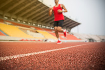a man running on a track 