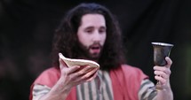 Jesus lifting up communion elements