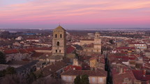 Arles church aerial view during dawn pink colored sky mystic aerial shot France Rhone river Provence 