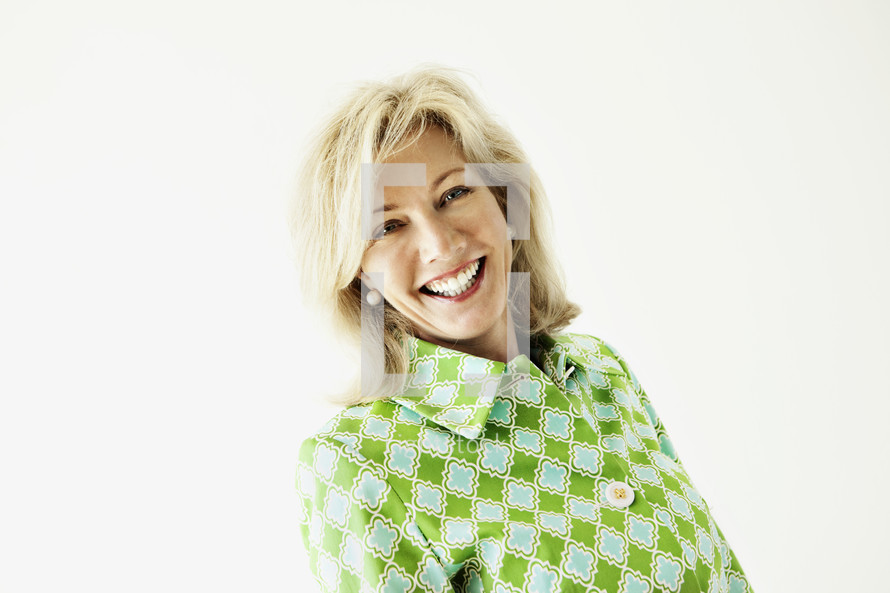 An adult woman smiling on white background
