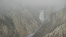 Lower Falls Waterfall and Yellowstone River at Grand Canyon of the Yellowstone National Park, Wyoming in Morning Fog viewed from Artist Point	
