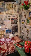 newspapers on bamboo walls 