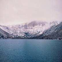 Lake at the foot of snow-covered mountains.