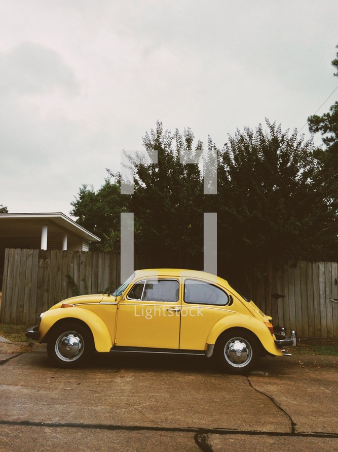 old yellow Volkswagen Beetle 