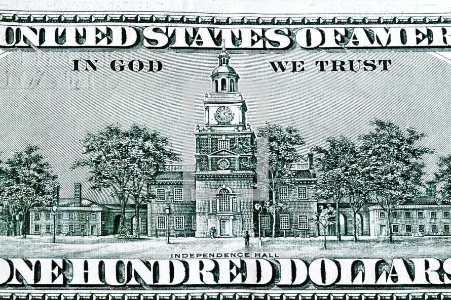 The backside of a one hundred dollar bill - Independence Hall - In God We Trust