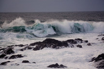 waves crashing into a shore 