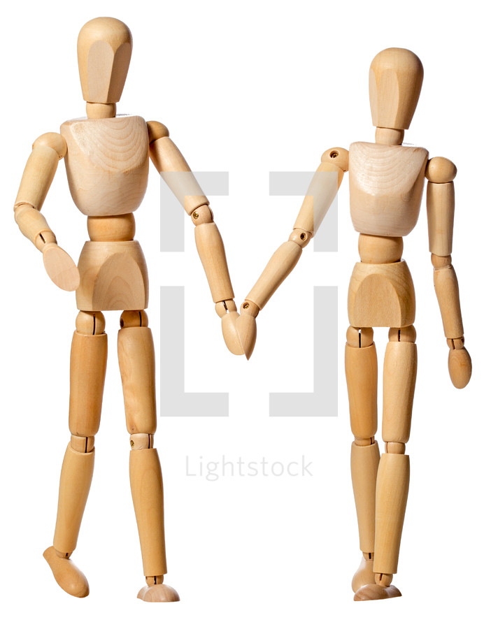 Manikin couple holding hands.