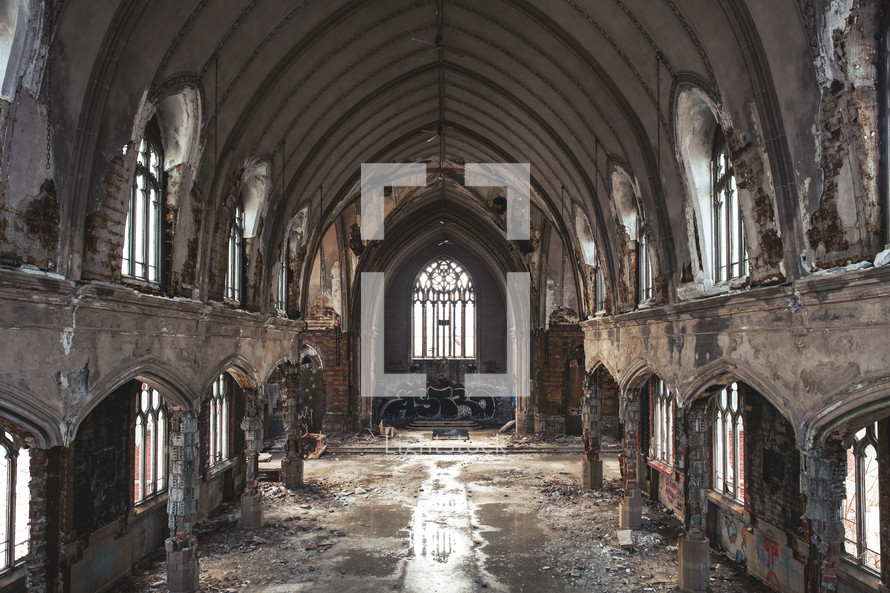 Shot of the sanctuary of a  deteriorating and abandoned church.