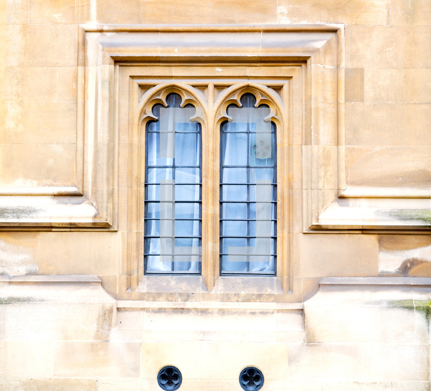 window and ornate detail on the exterior of a cathedral in London 