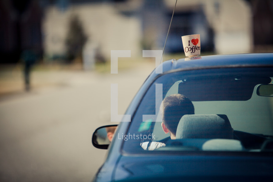 I heart coffee on top of a moving car roof