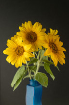 vase of yellow flowers 