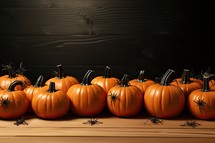Halloween pumpkins on wooden background with copy space for your text