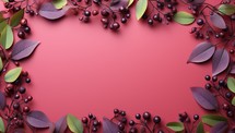 Autumn leaves and berries on pink background.