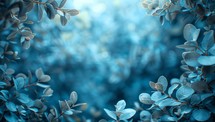 Blue leaves background with copy space, soft focus. Nature background.