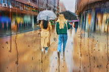 people with an umbrella in rainy days in Bilbao city, spain