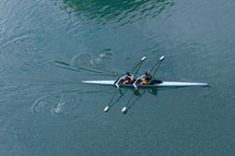 athletes paddling canoes on the nervouson river