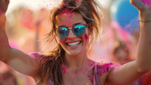 Young woman having fun at Holi color festival