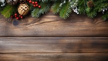 Christmas fir tree branches on wooden background. Top view with copy space