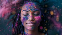 Portrait of a young woman covered in colorful powder