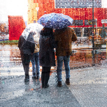 people with an umbrella in rainy days in Bilbao city, basque country. Spain
