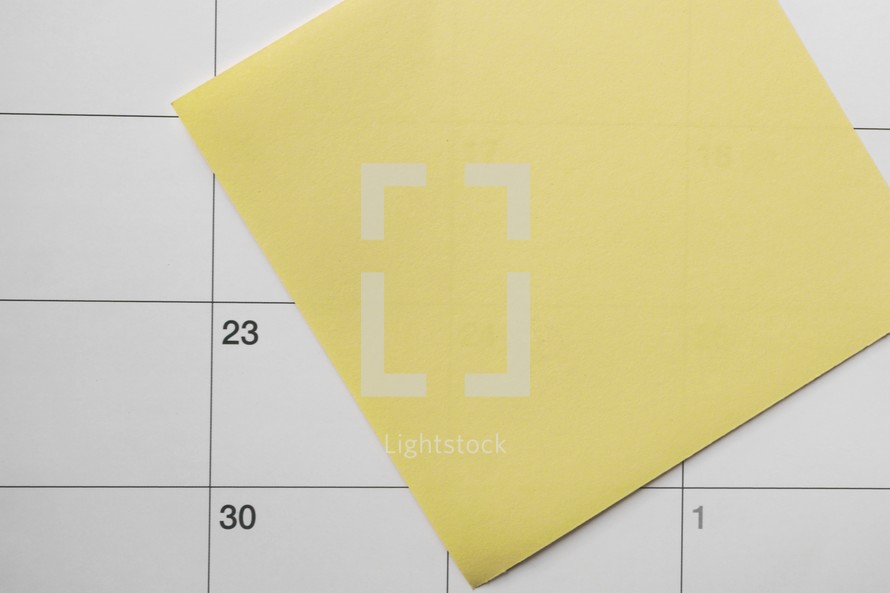 yellow post it on the calendar