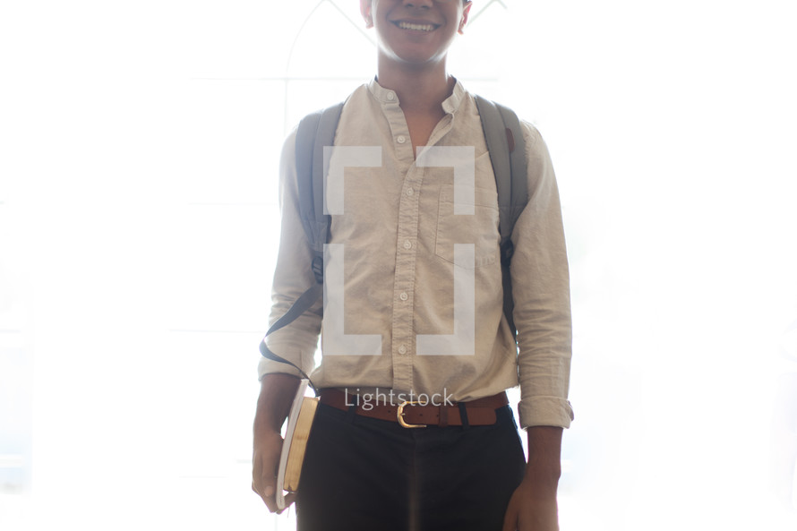 student standing in front of a white background 