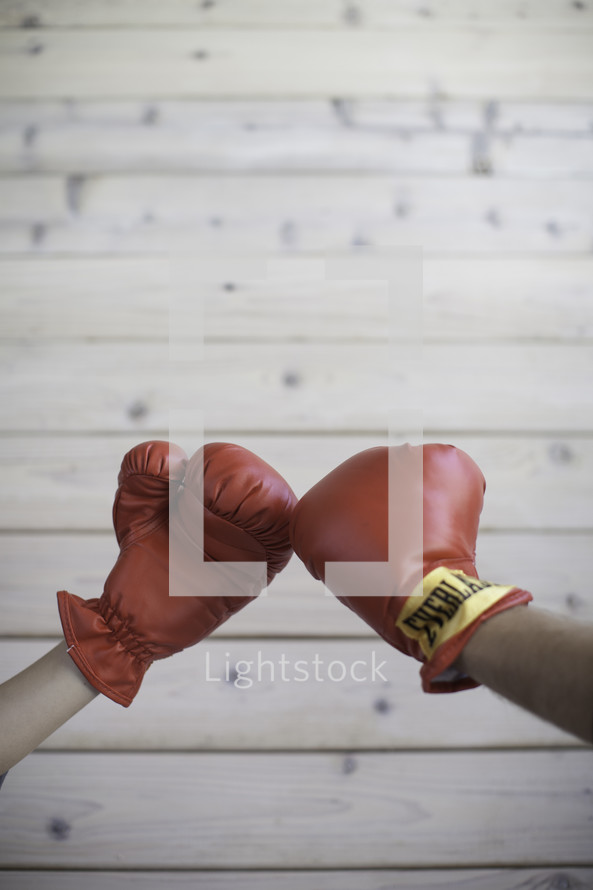 boxing couple touching gloves 