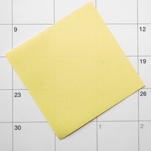yellow post it on the calendar