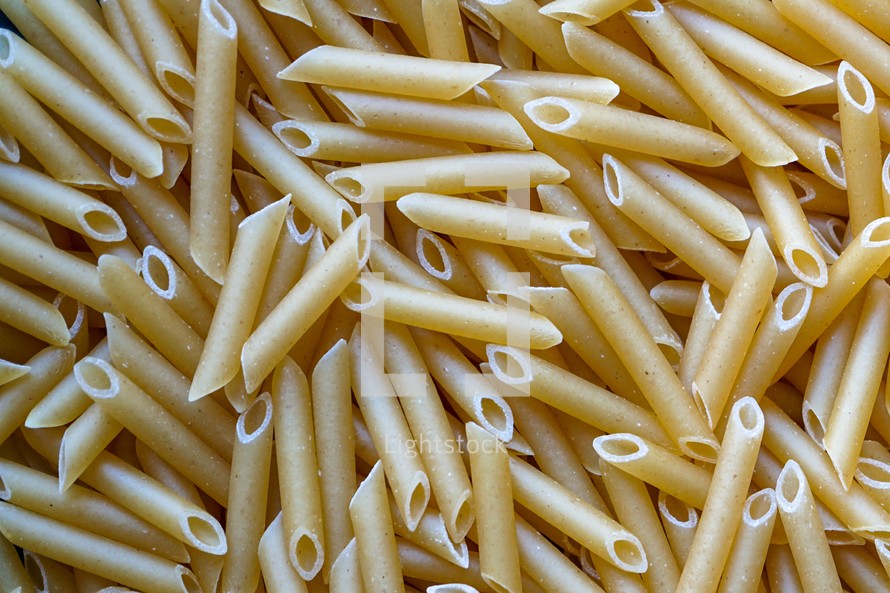 raw macaroni pasta background, italian food