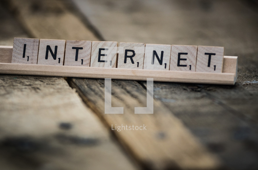 Scrabble tiles spelling out "internet."