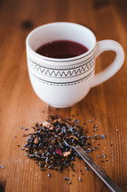 tea and a mug on a wood table 