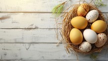 Easter eggs in nest on white wooden background with copy space.