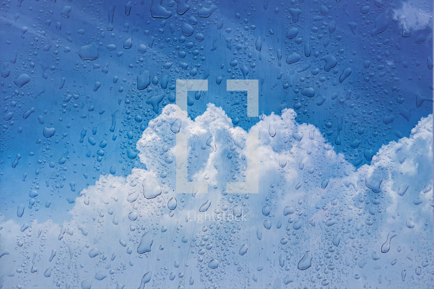drops on the window and cloud sky background