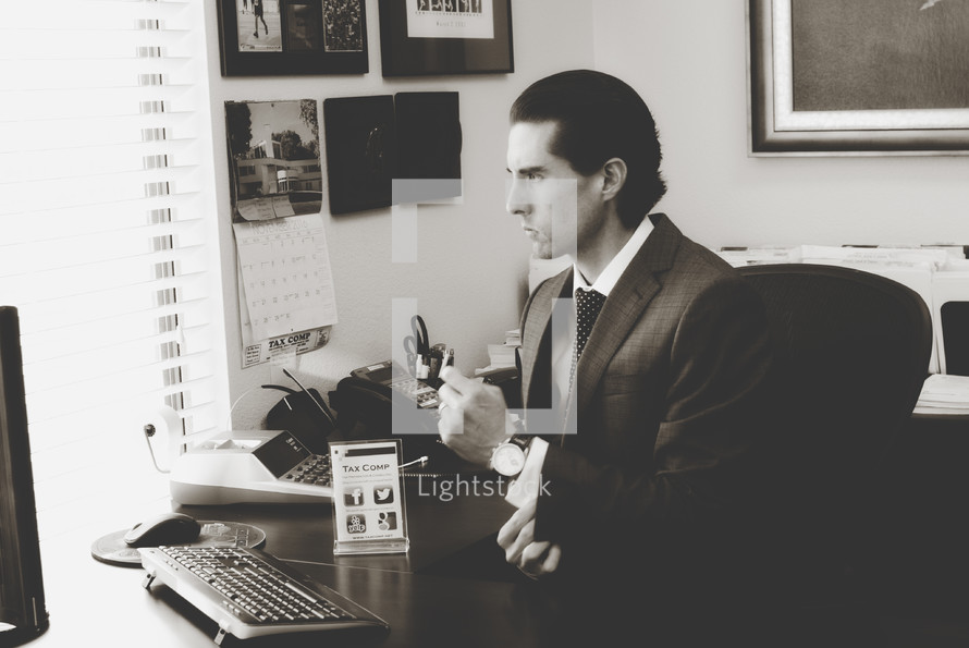 A businessman sitting at a desk 