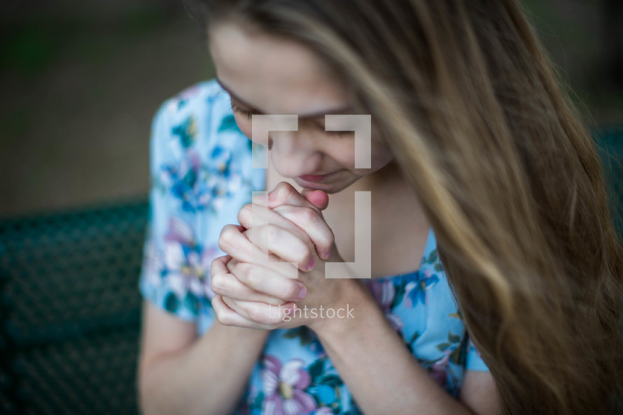 young woman in prayer