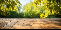 Empty wooden table for product placement in front of green nature background