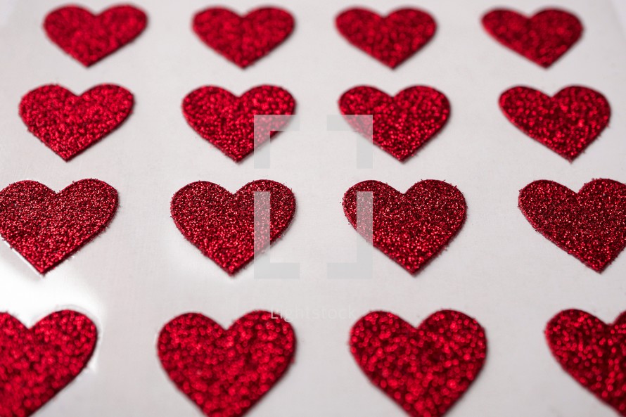 red heart shapes on the white background in valentine's day