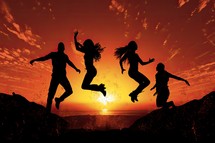 Silhouette of a group of people jumping in the air at sunset