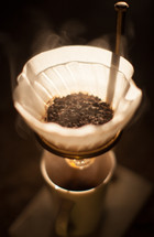 steam rising from a coffee filter 